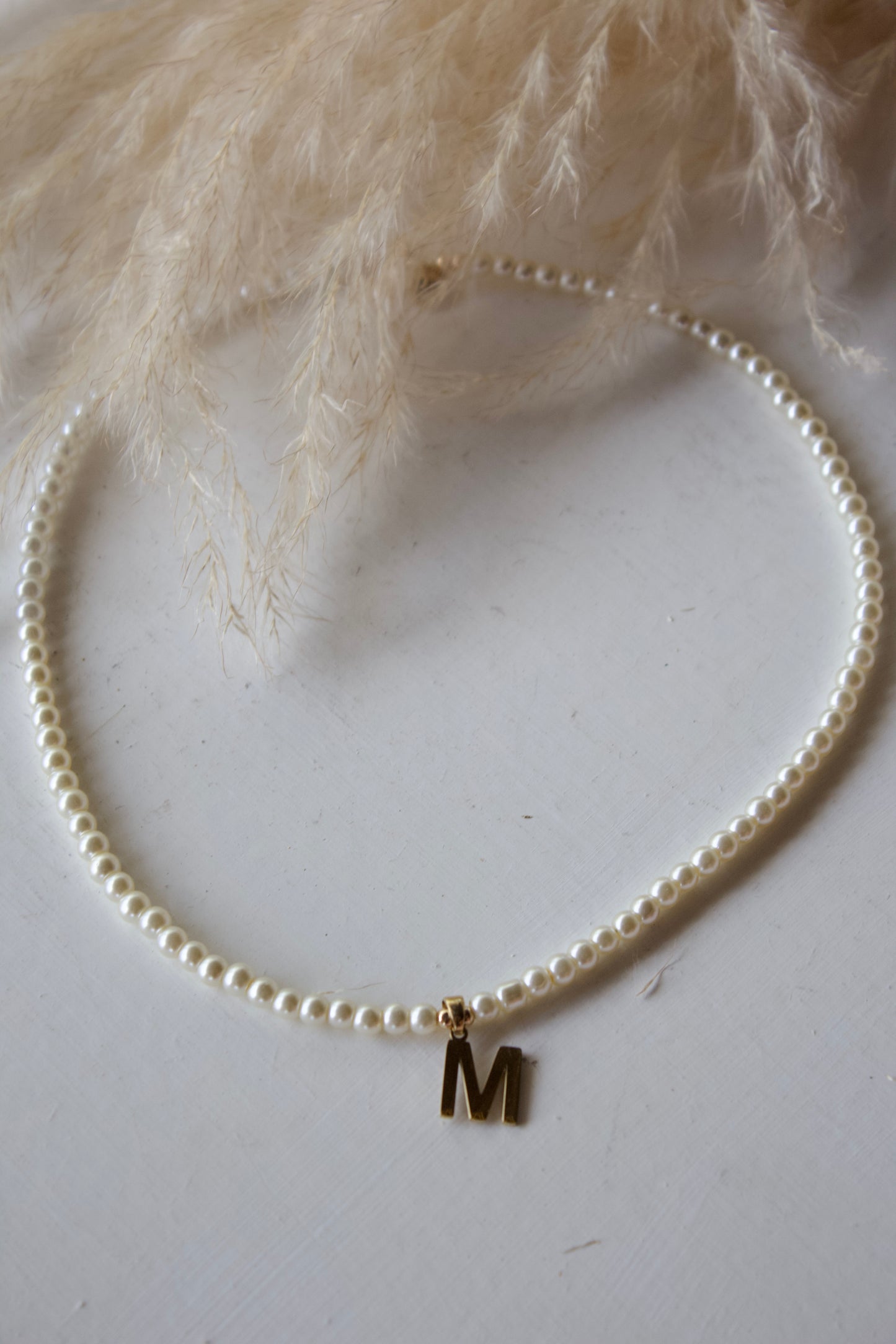 Collar letra perlitas