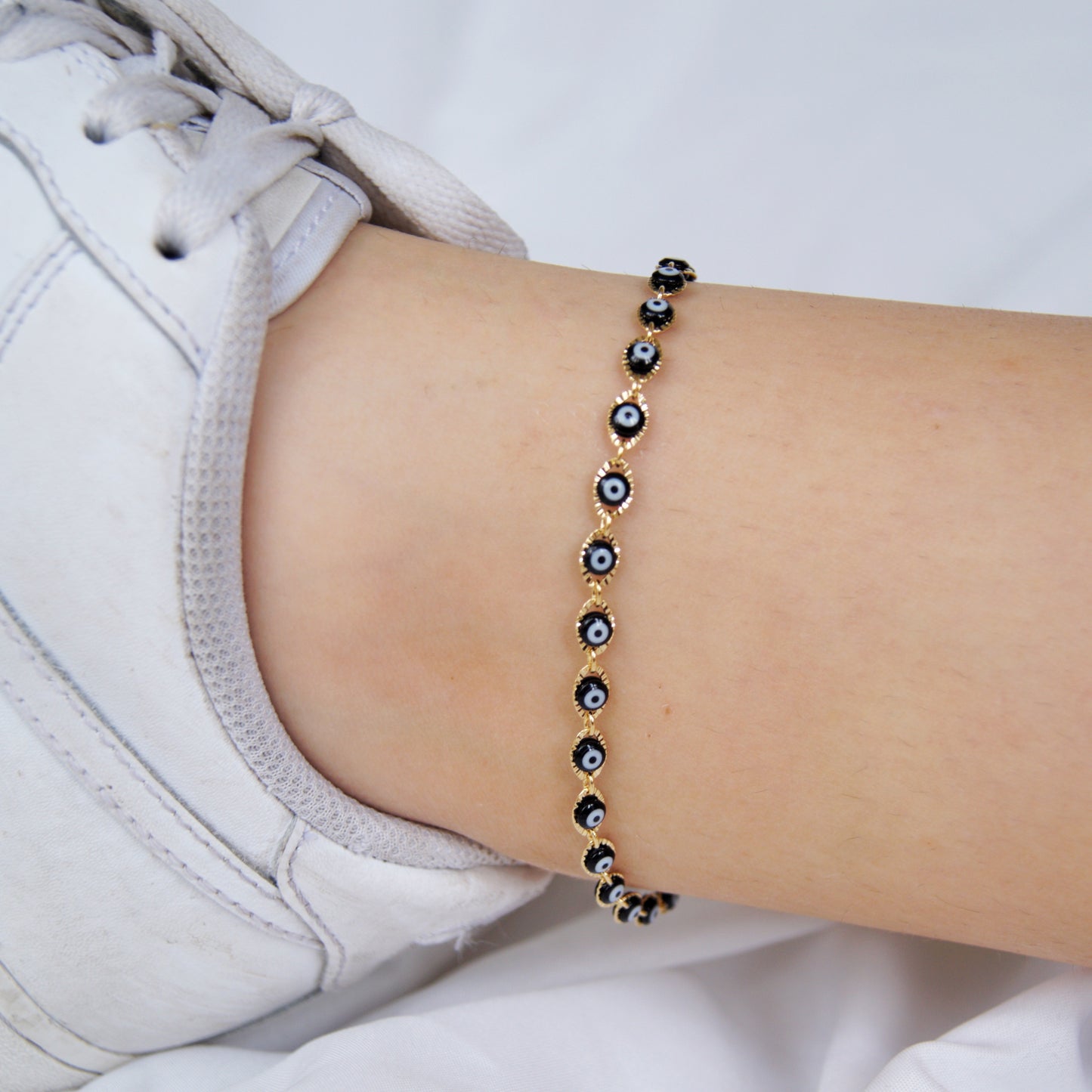 Tobillera ojos negros